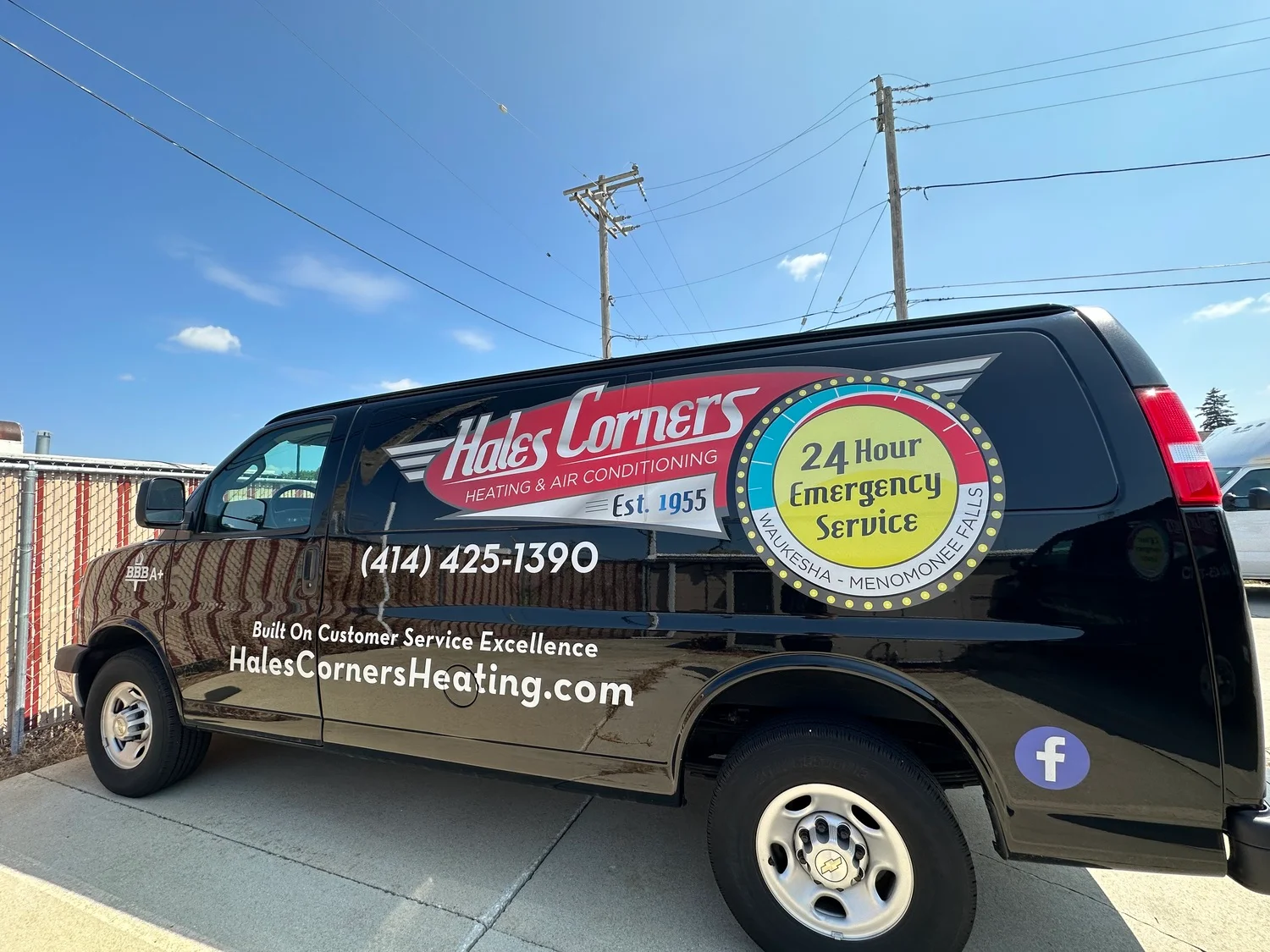 A van with the Hales Corners Heating & Air Conditioning logo, representing nearby air conditioning repair and installation services.